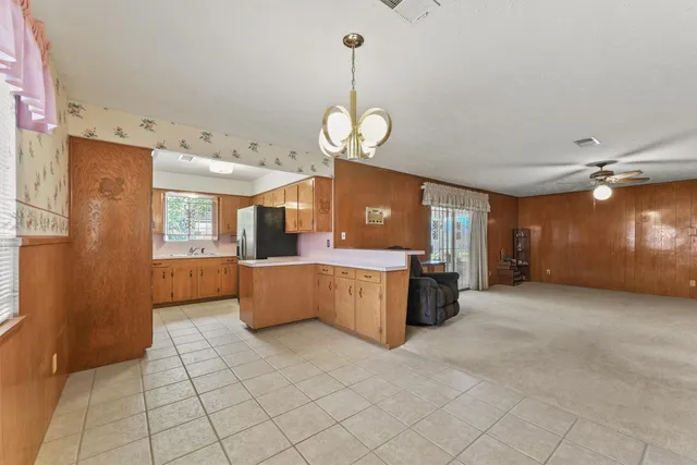 a view of a kitchen with cabinet and staircase