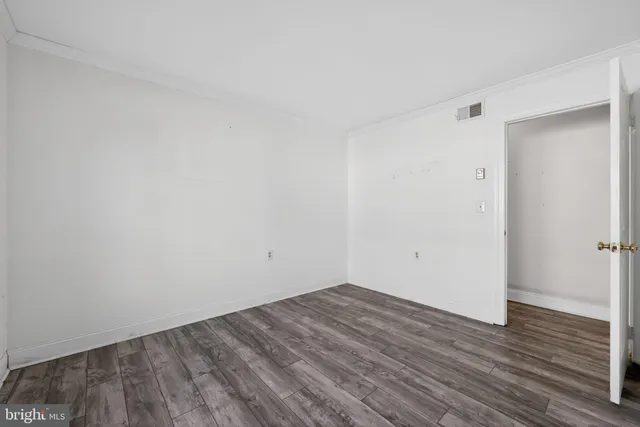 a view of room with wooden floor