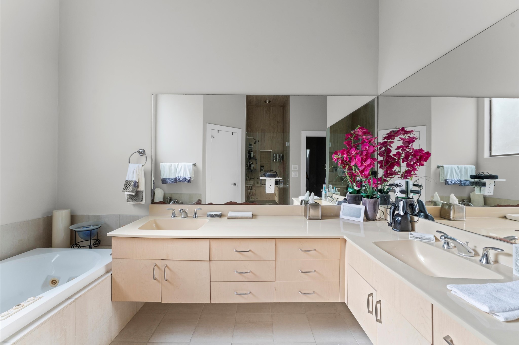 730 Ruthven Street Houston, TX 77019 - Photo 16 of 36 a bathroom with a sink vanity mirror and tub