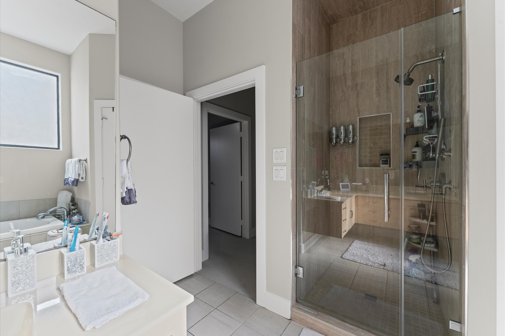 730 Ruthven Street Houston, TX 77019 - Photo 17 of 36 a bathroom with a shower and a sink