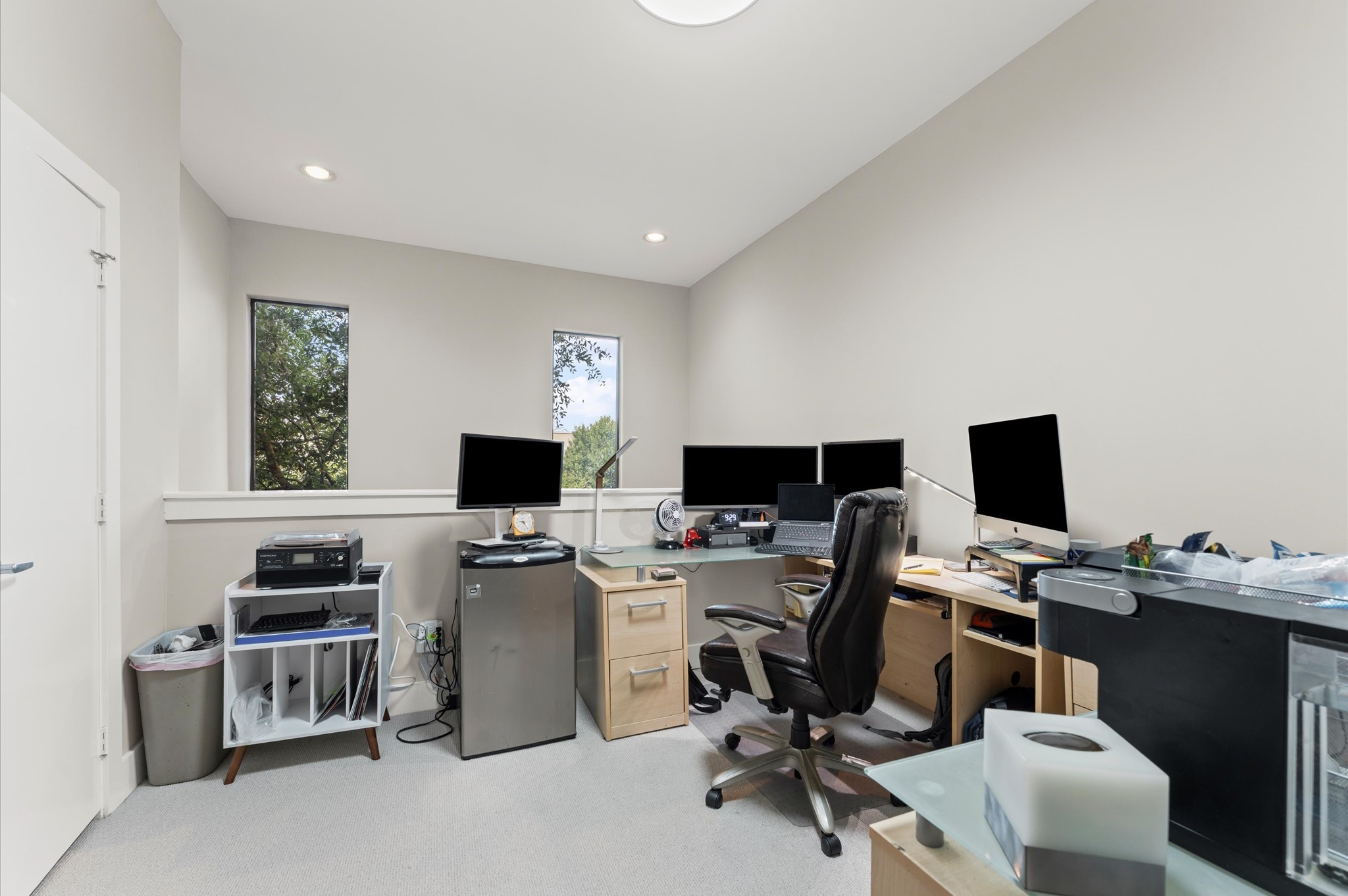 730 Ruthven Street Houston, TX 77019 - Photo 19 of 36 a view of a workspace with furniture and a window