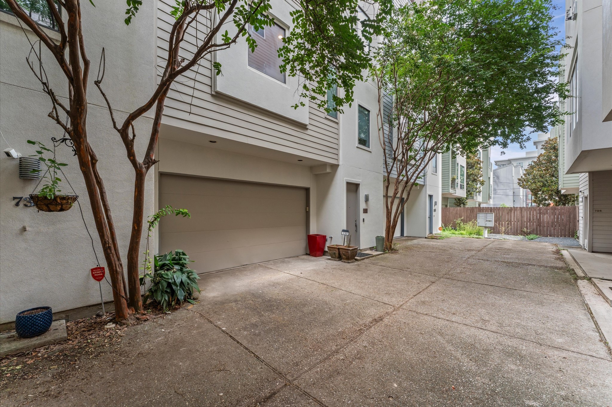 730 Ruthven Street Houston, TX 77019 - Photo 27 of 36 a view of a house with a tree and a garage