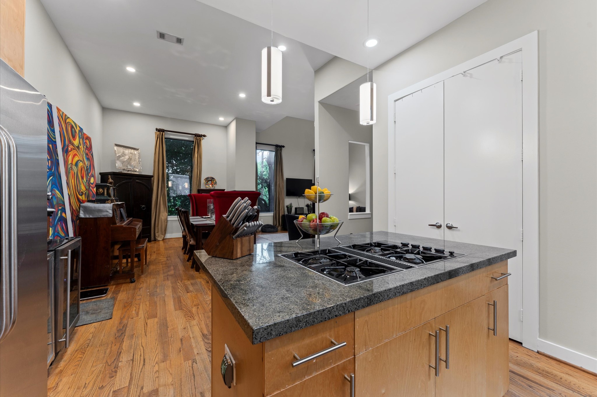 730 Ruthven Street Houston, TX 77019 - Photo 9 of 36 a kitchen with stainless steel appliances granite countertop a sink stove and cabinets
