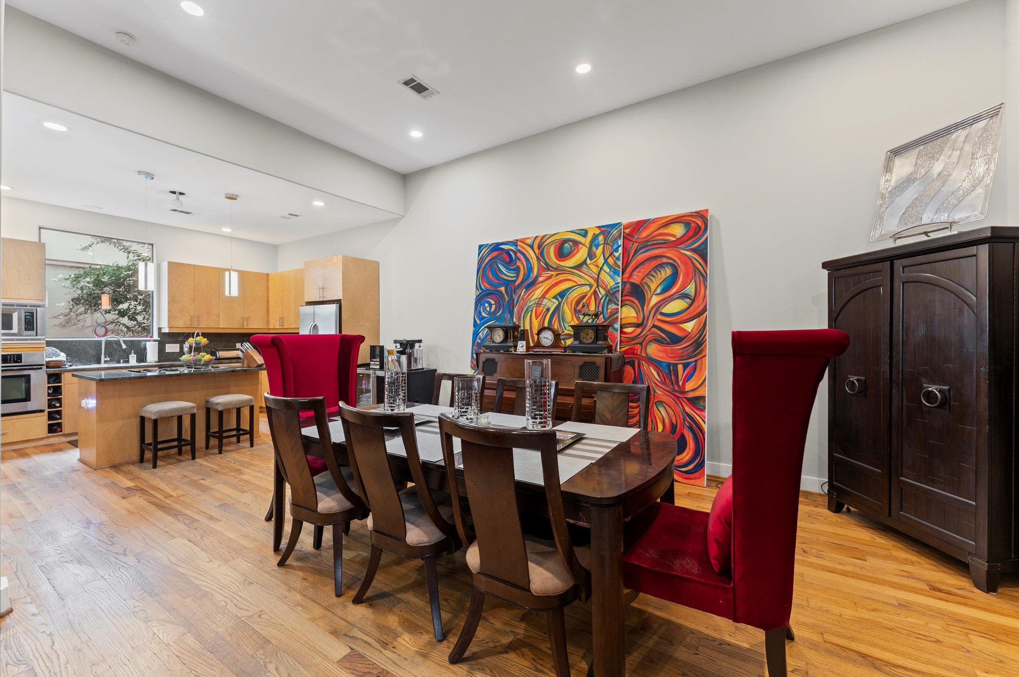 730 Ruthven Street Houston, TX 77019 - Photo 10 of 36 a view of a dining room with furniture wooden floor and chandelier