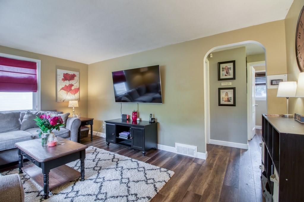 129 Amostown Road West Springfield, MA 01089 - Photo 12 of 25 a living room with furniture and a flat screen tv
