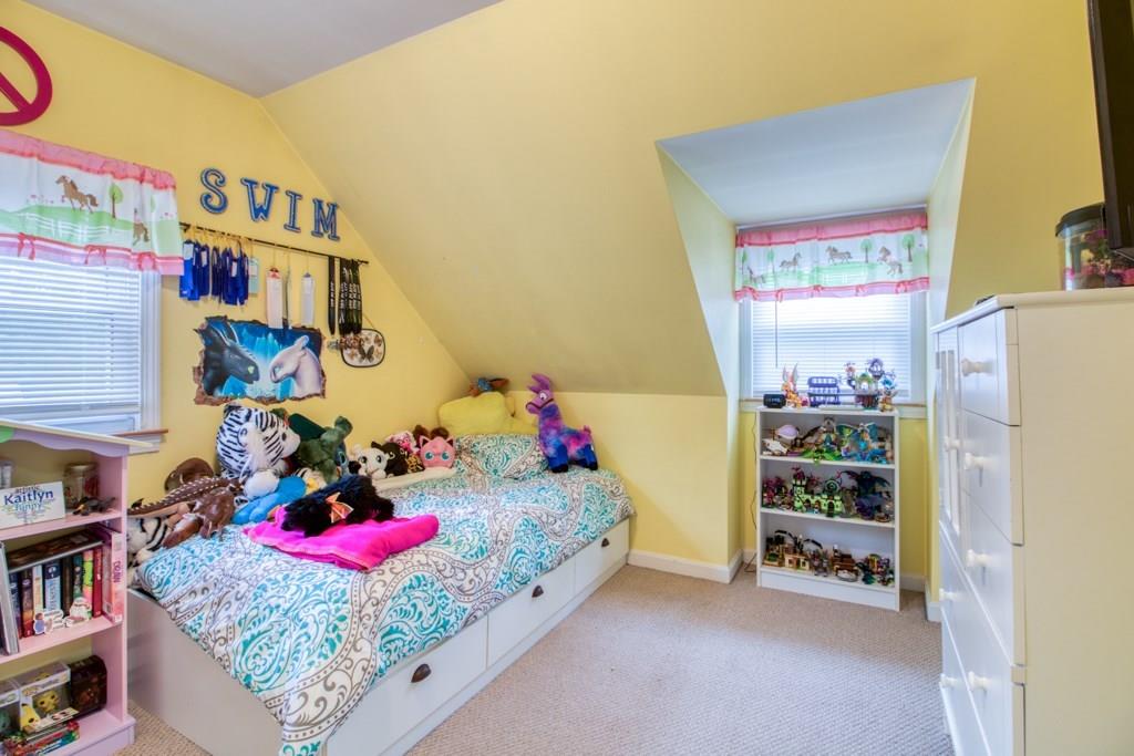 129 Amostown Road West Springfield, MA 01089 - Photo 15 of 25 a bedroom with furniture and a book shelf