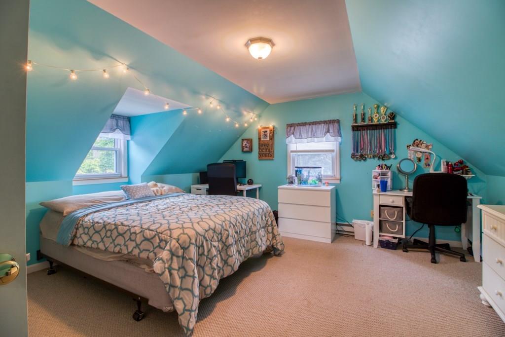 129 Amostown Road West Springfield, MA 01089 - Photo 16 of 25 a bedroom with a bed and a chair