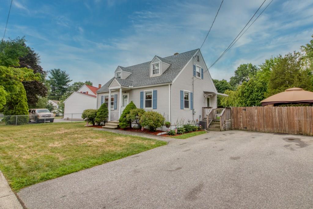 129 Amostown Road West Springfield, MA 01089 - Photo 2 of 25 a front view of a house with a yard and garage