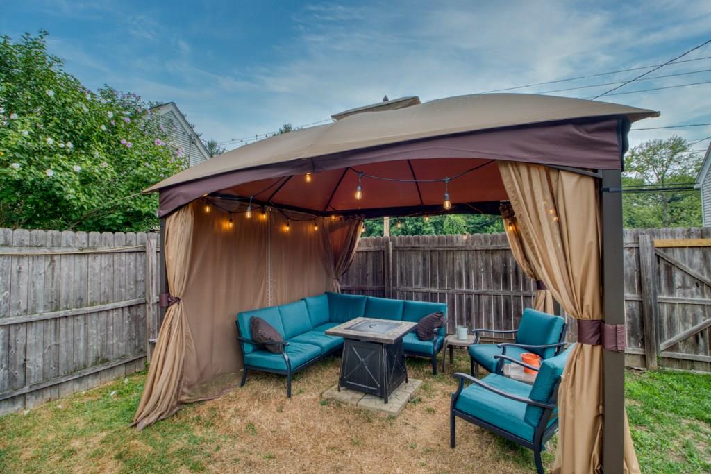 129 Amostown Road West Springfield, MA 01089 - Photo 21 of 25 a backyard of a house with table and chairs