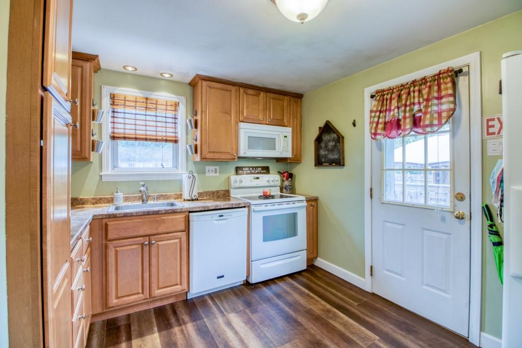 129 Amostown Road West Springfield, MA 01089 - Photo 4 of 25 a kitchen with stainless steel appliances granite countertop a stove a sink and a refrigerator