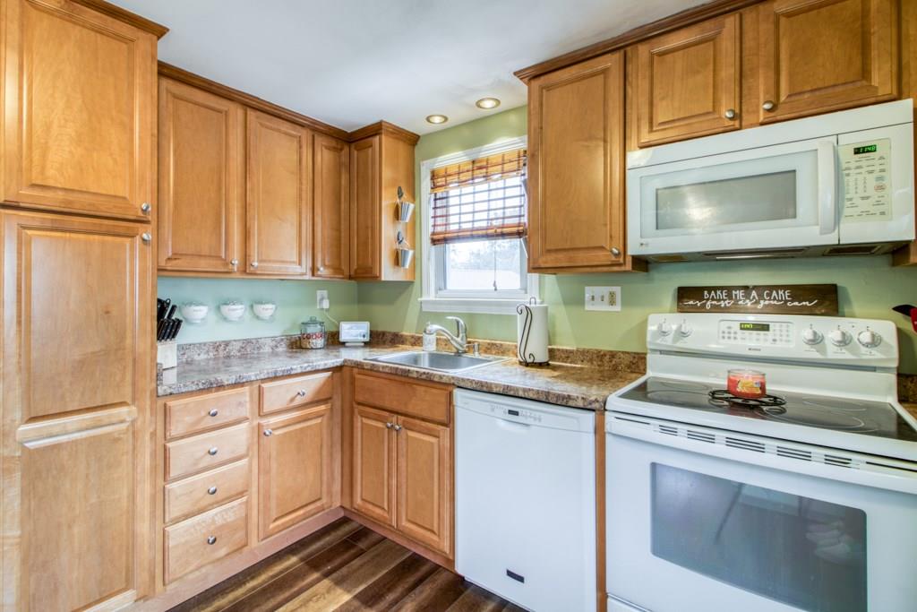 129 Amostown Road West Springfield, MA 01089 - Photo 5 of 25 a kitchen with cabinets appliances a sink and a window