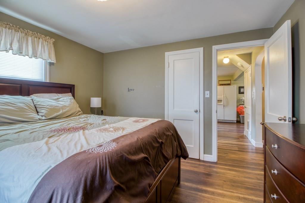 129 Amostown Road West Springfield, MA 01089 - Photo 10 of 25 a bedroom with a bed and wooden floor