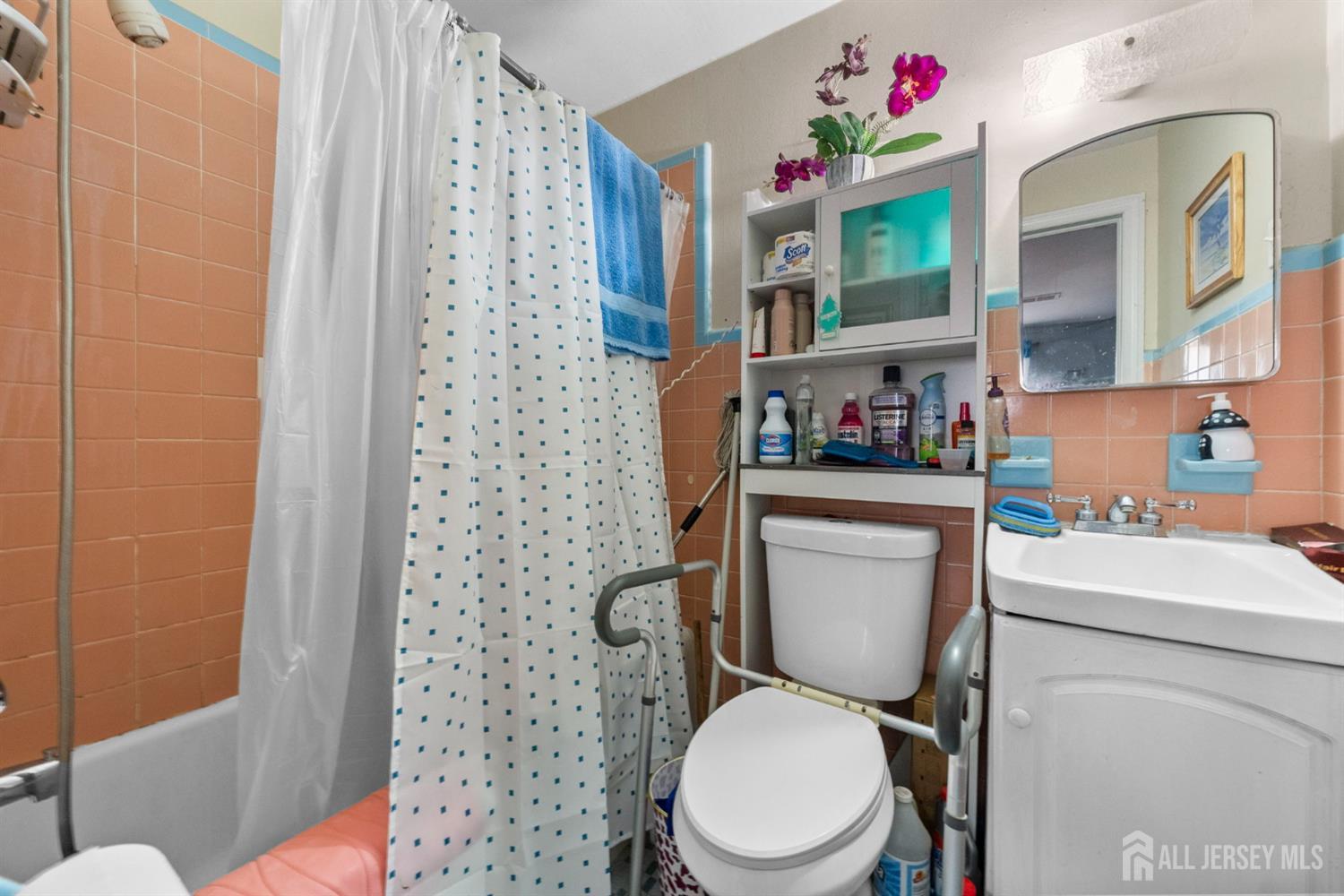 973 Ellis Parkway Edison, NJ 08820 - Photo 13 of 34 a white toilet sitting next to a bathroom sink
