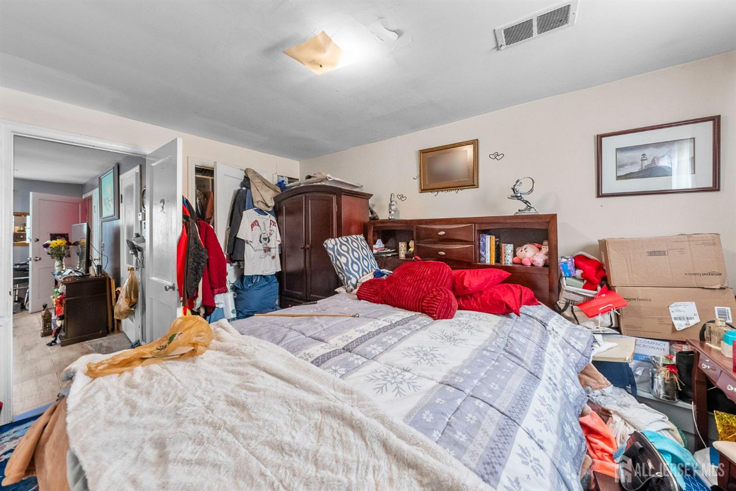 973 Ellis Parkway Edison, NJ 08820 - Photo 19 of 34 a bed room with a bed and a couch