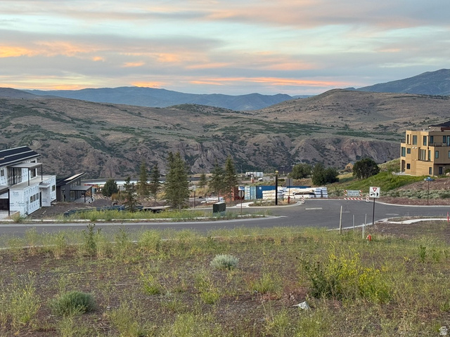 3923 East Harris Way Heber City, UT 84036 - Photo 4 of 12 Expansive mountain backdrop with a visible road structure and varying architectural styles