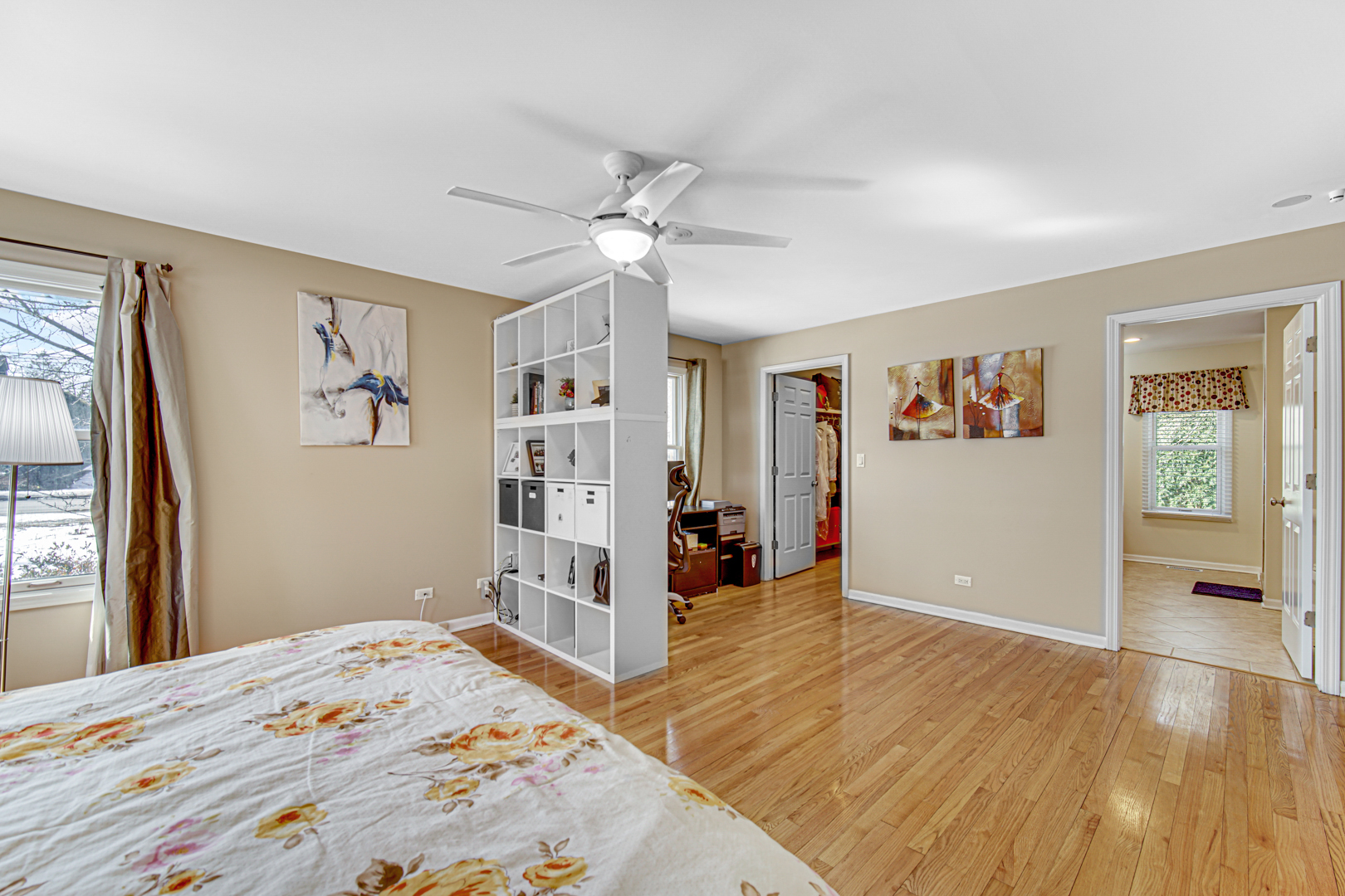 1855 North Happ Road Northbrook, IL 60062 - Photo 15 of 32 a bedroom with a bed and a dresser with rug