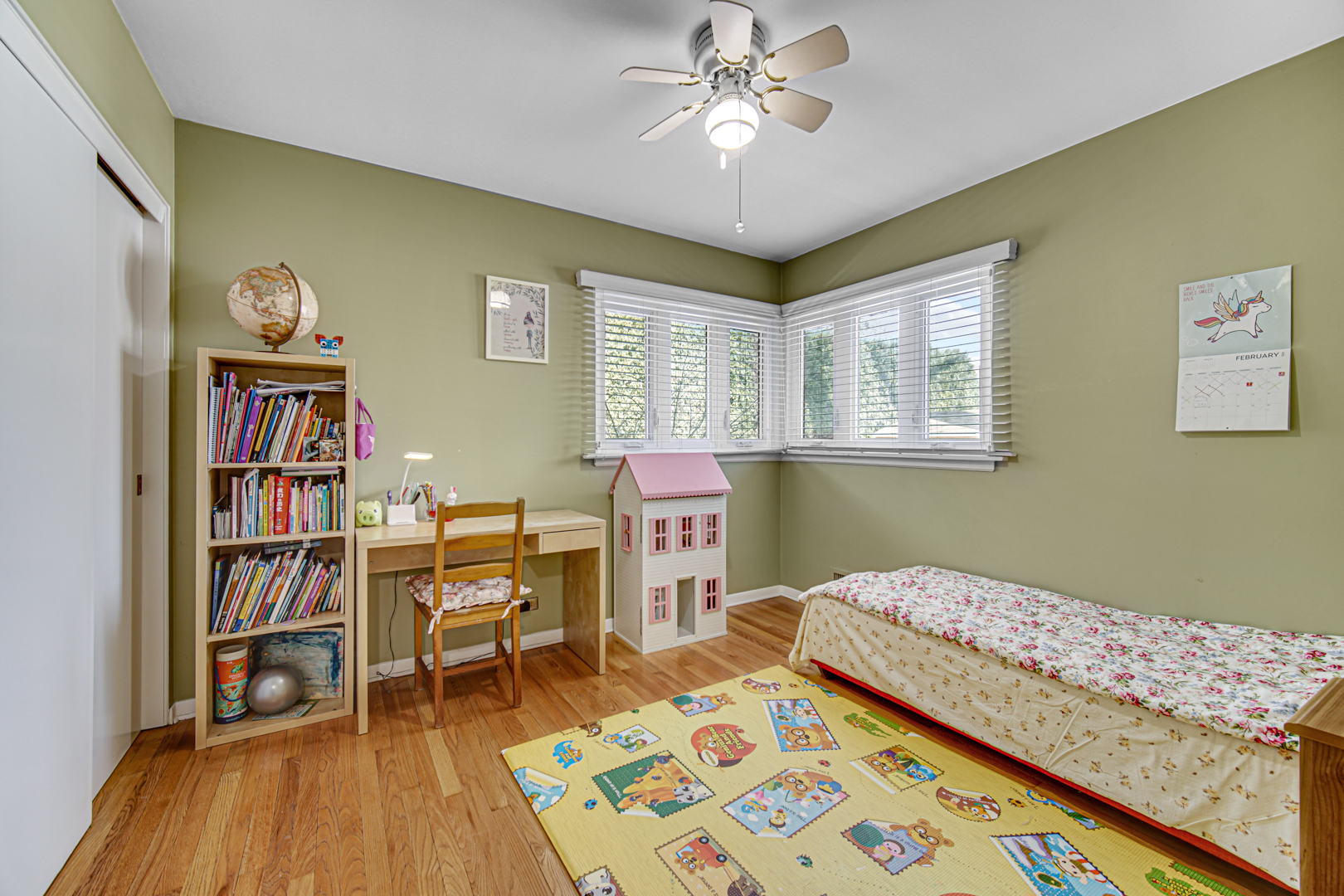 1855 North Happ Road Northbrook, IL 60062 - Photo 17 of 32 a bedroom with a bed and a bookshelf