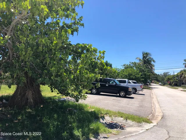 a view of a yard with an outdoor seating
