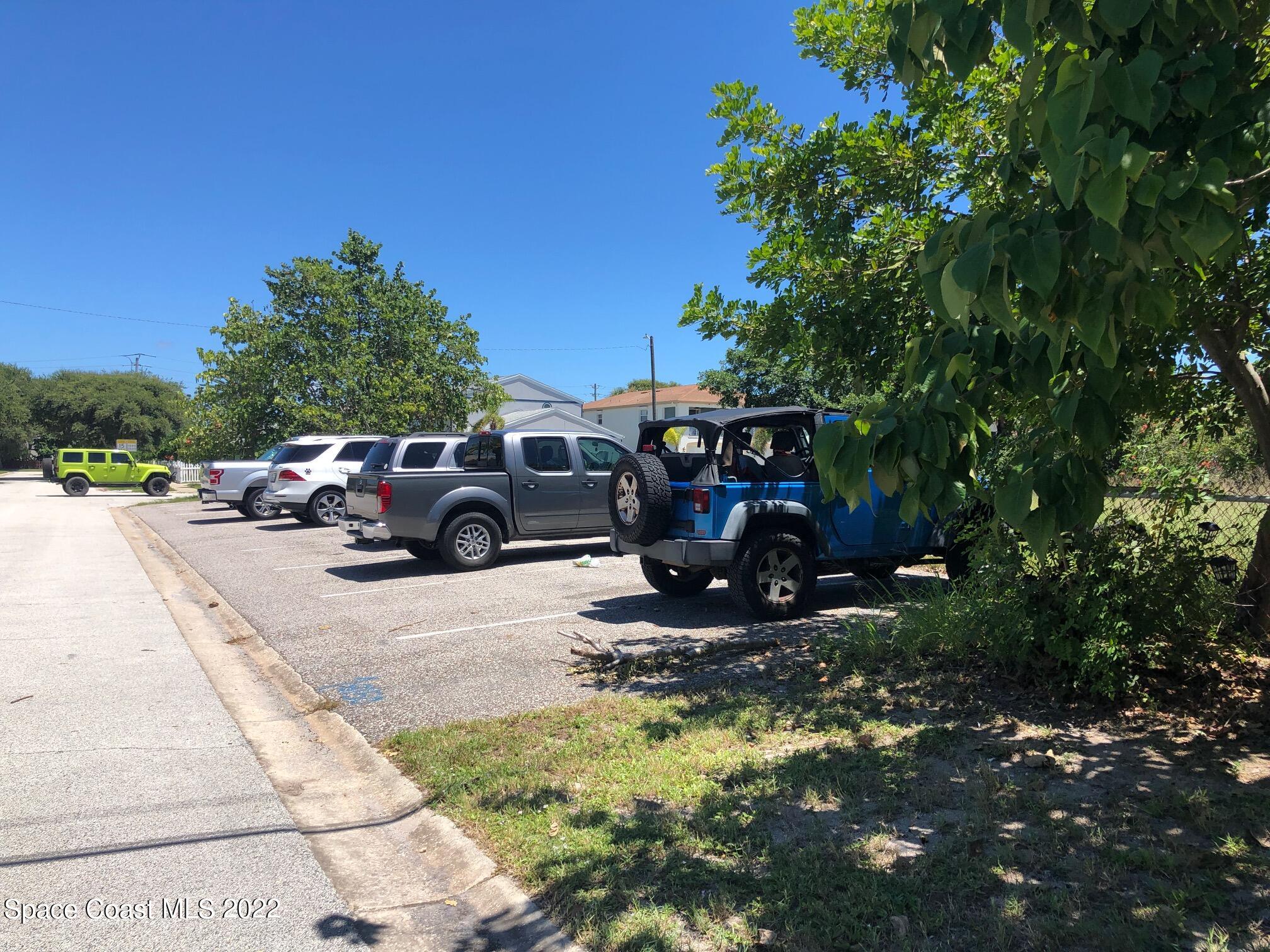 0 Rosalind Avenue Cape Canaveral, FL 32920 - Photo 5 of 10 a view of car parked on the side of the road