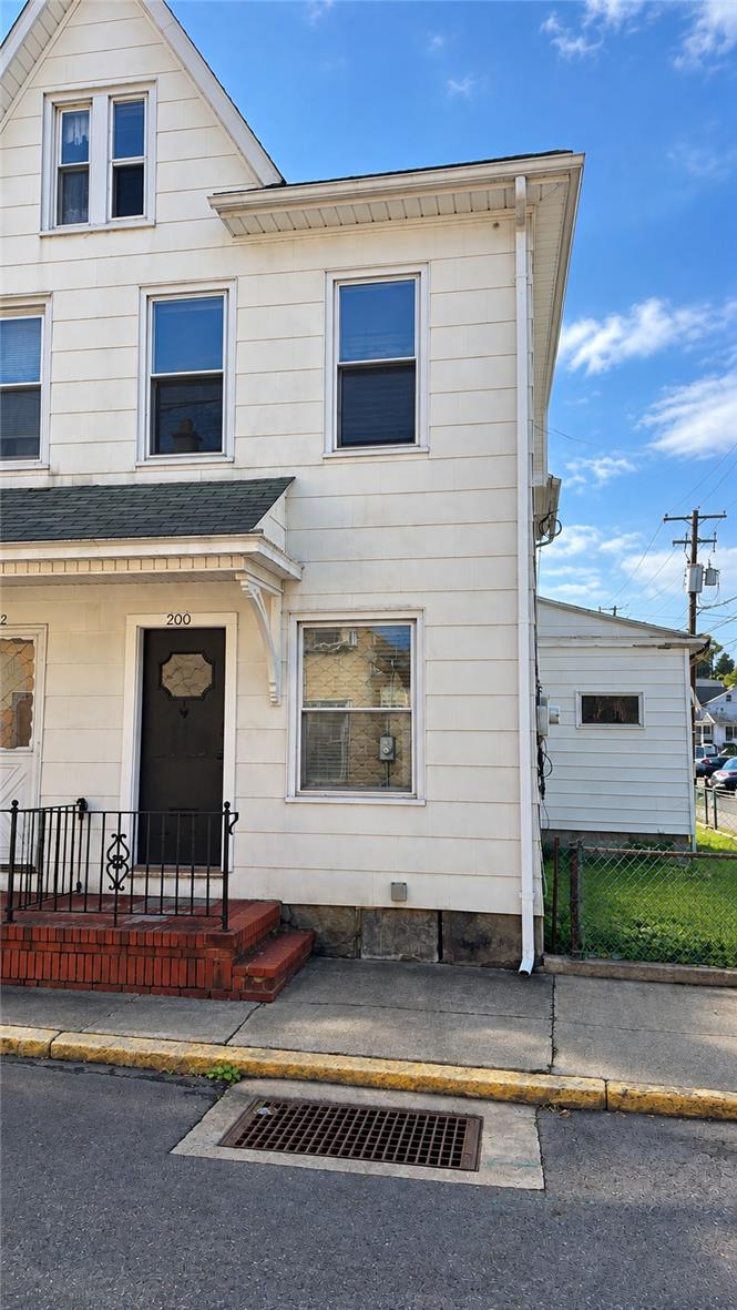 200 South Coal Street Shamokin, PA 17872 - Photo 1 of 18 Classic multi-story architecture features vinyl siding, stone foundations, and a brick entry porch.