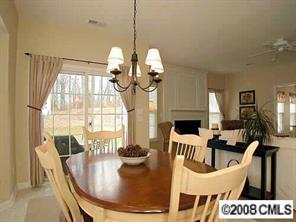 854 Haymarket Place Fort Mill, SC 29708 - Photo 2 of 8 a dining room with furniture a chandelier and window