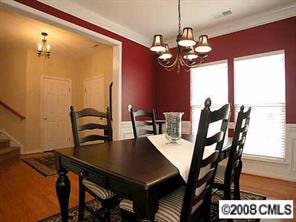 854 Haymarket Place Fort Mill, SC 29708 - Photo 3 of 8 a view of a dining room with furniture and chandelier