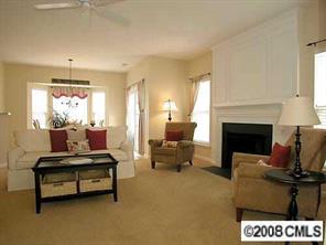 854 Haymarket Place Fort Mill, SC 29708 - Photo 5 of 8 a living room with furniture a fireplace and a table