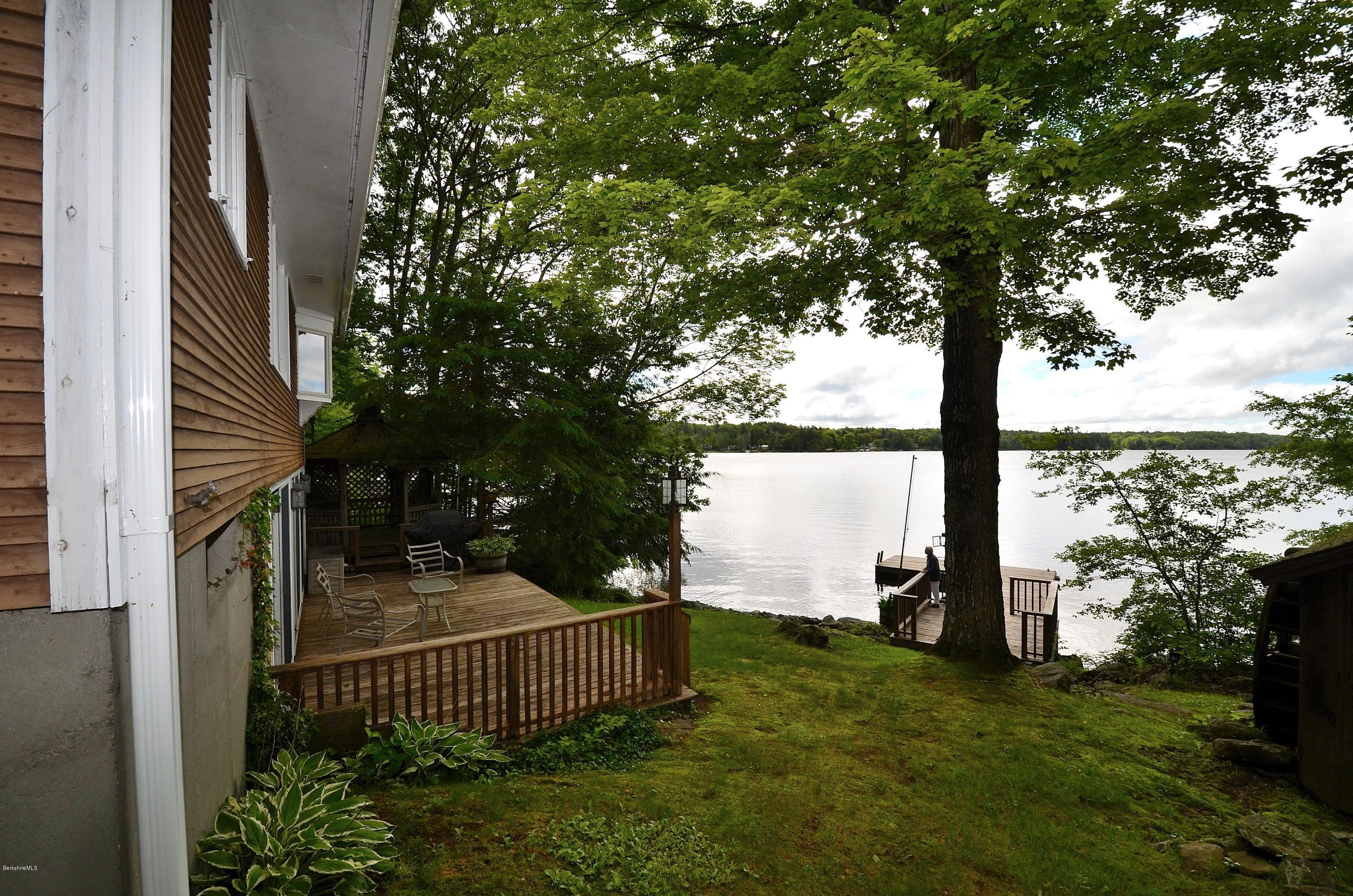 996 Reservoir Road Otis, MA 01029 - Photo 1 of 23 a view of a garden with iron fence