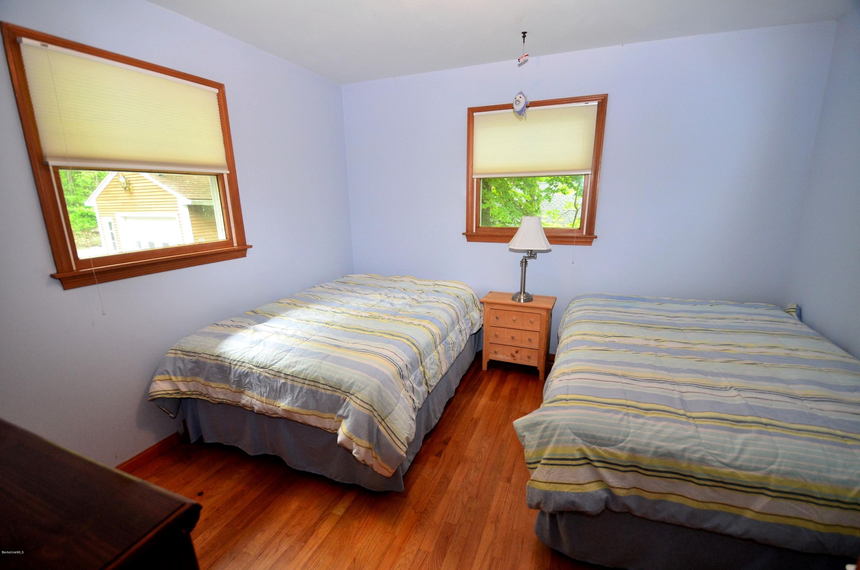996 Reservoir Road Otis, MA 01029 - Photo 11 of 23 a bedroom with a bed and a window