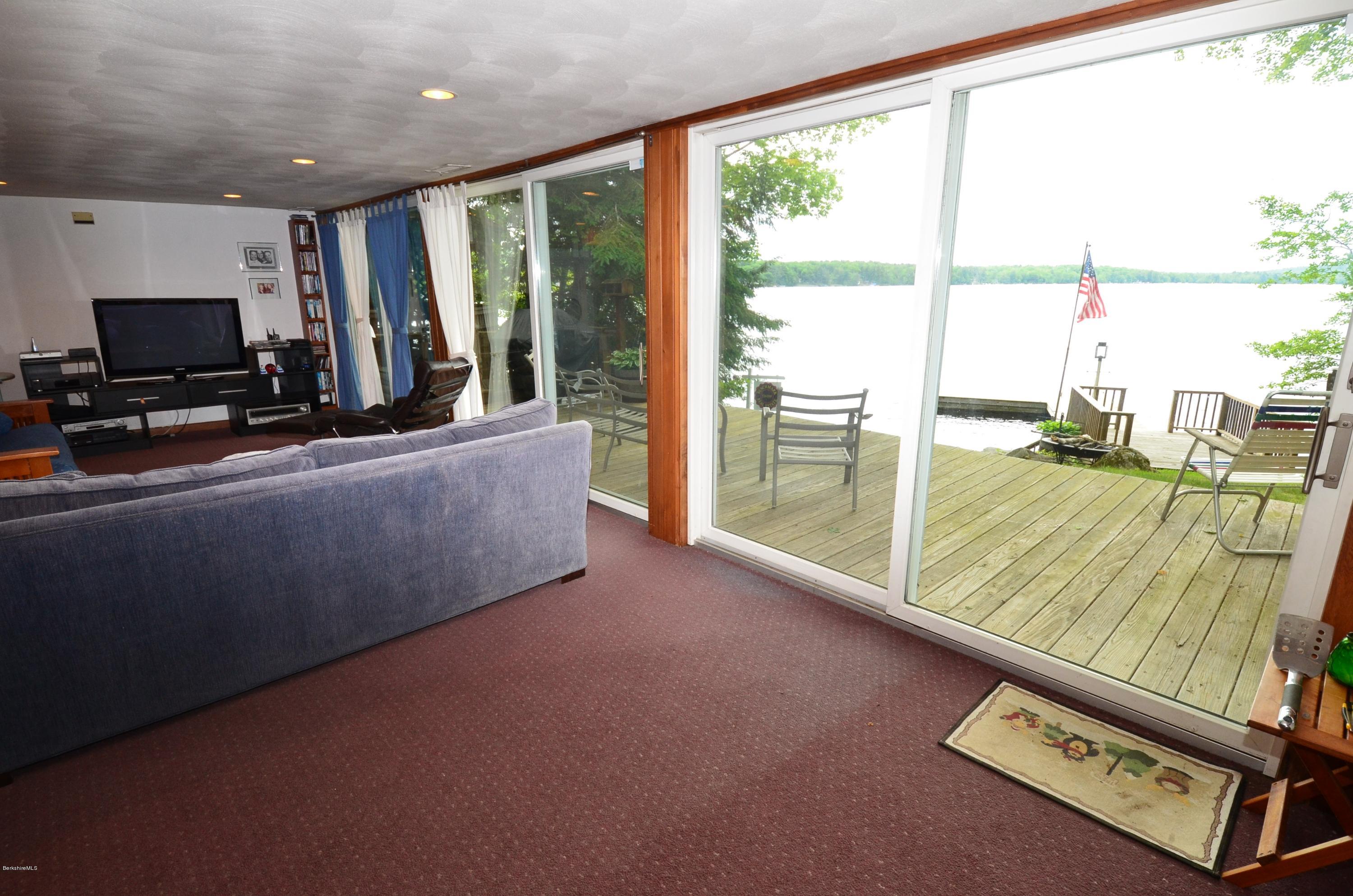 996 Reservoir Road Otis, MA 01029 - Photo 15 of 23 a living room with furniture and a flat screen tv