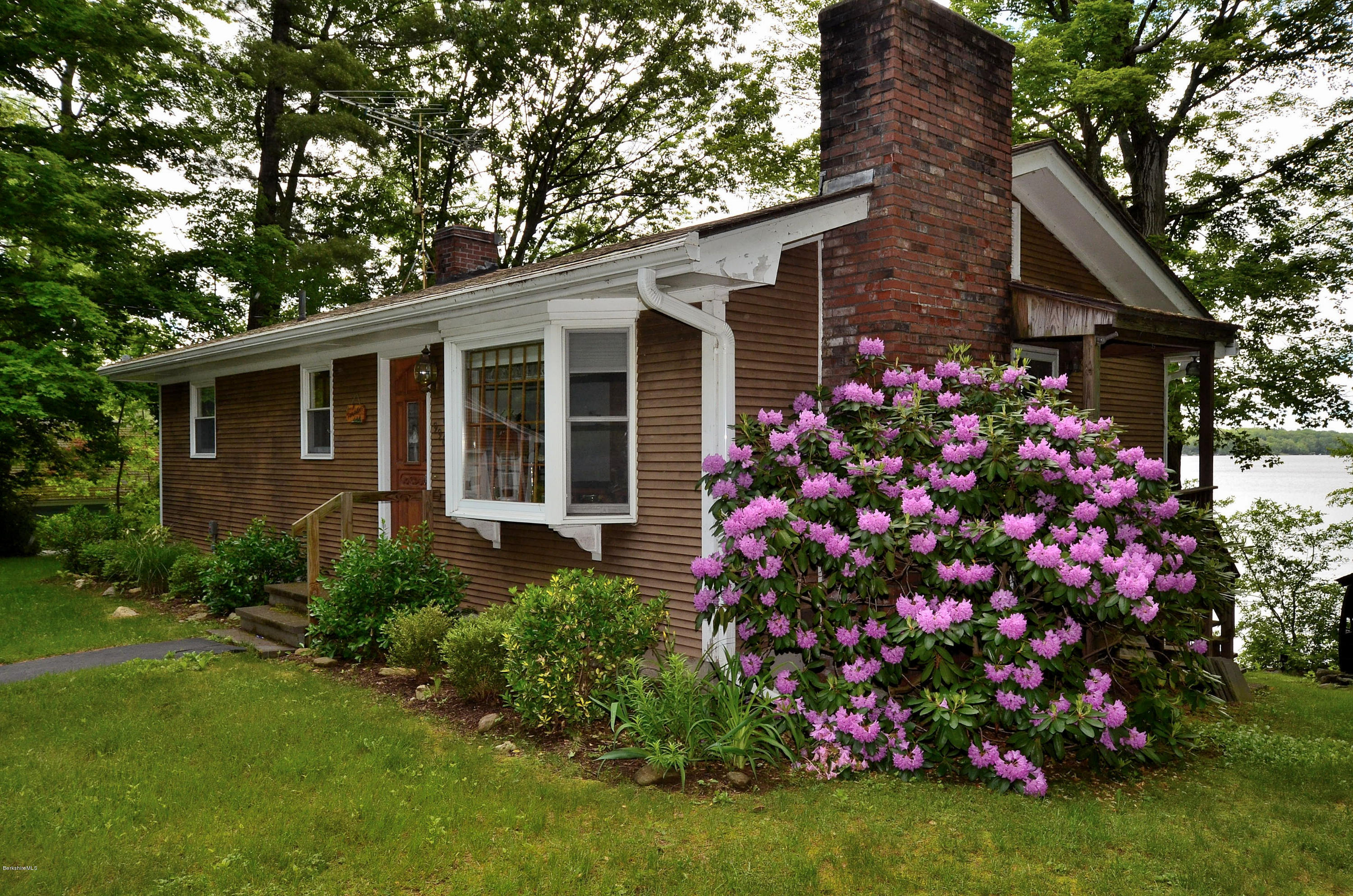 996 Reservoir Road Otis, MA 01029 - Photo 18 of 23 a front view of a house with garden
