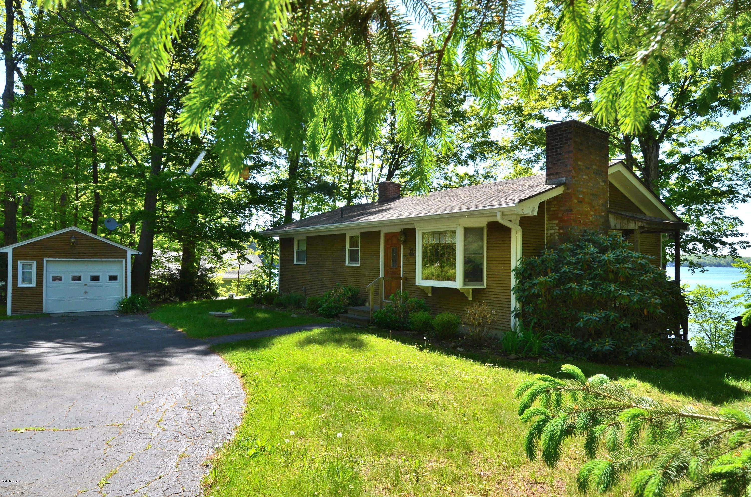 996 Reservoir Road Otis, MA 01029 - Photo 19 of 23 a front view of a house with garden