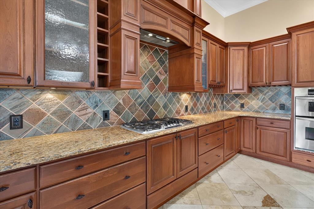 9427 Eddings Road Odessa, FL 33556 - Photo 25 of 93 a kitchen with granite countertop a sink and a stove