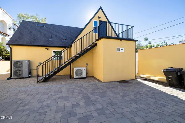 a view of a balcony with wooden floor