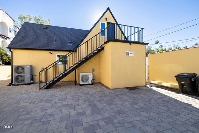 a view of a balcony with wooden floor