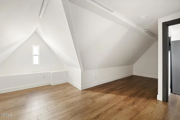 a bathroom with a sink a mirror and a shower