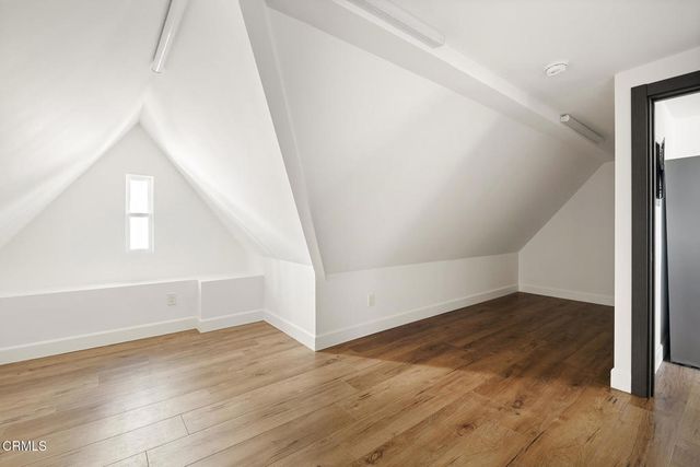 a bathroom with a sink a mirror and a shower