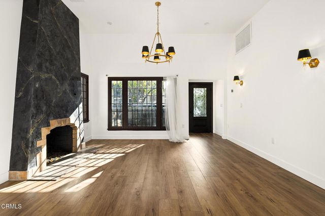 a view of an entryway with wooden floor