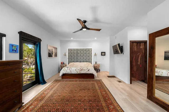 a view of a sink a counter top space and a window