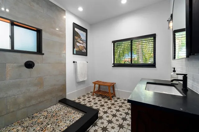 a living room with furniture and flowers