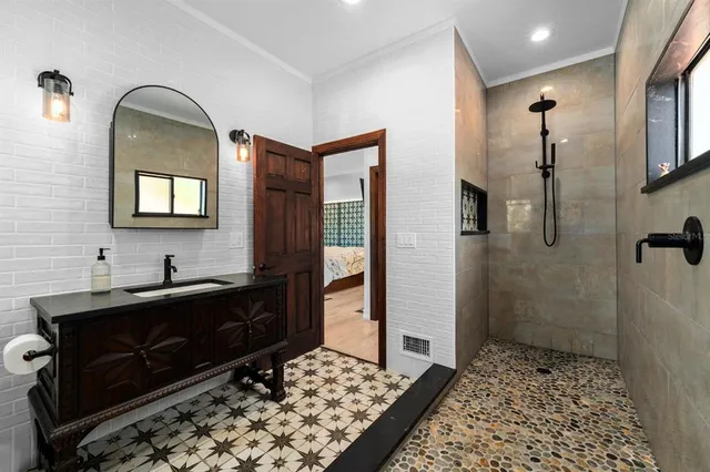 a kitchen with a sink refrigerator and cabinets