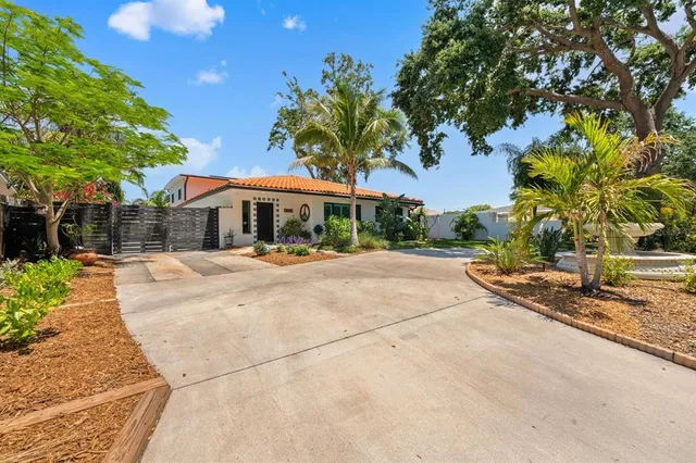 a view of a chairs and table in the patio