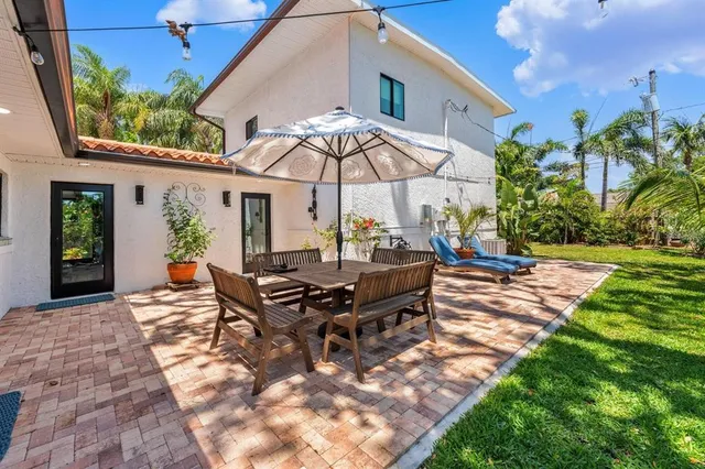 a view of yard from deck having patio