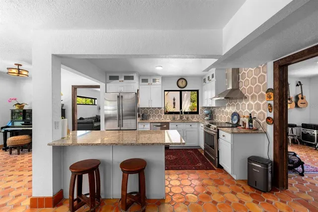 a living room filled with furniture and a window