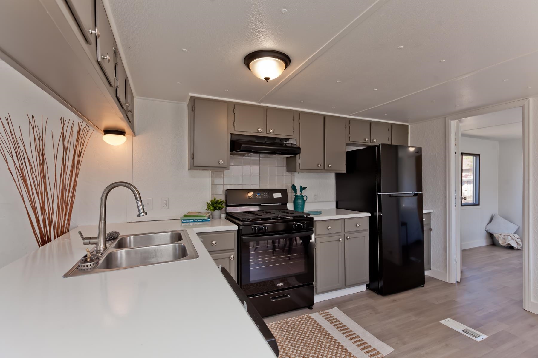 432 Pisces Circle Fruita, CO 81521 - Photo 12 of 40 a kitchen with stainless steel appliances granite countertop a refrigerator sink and stove