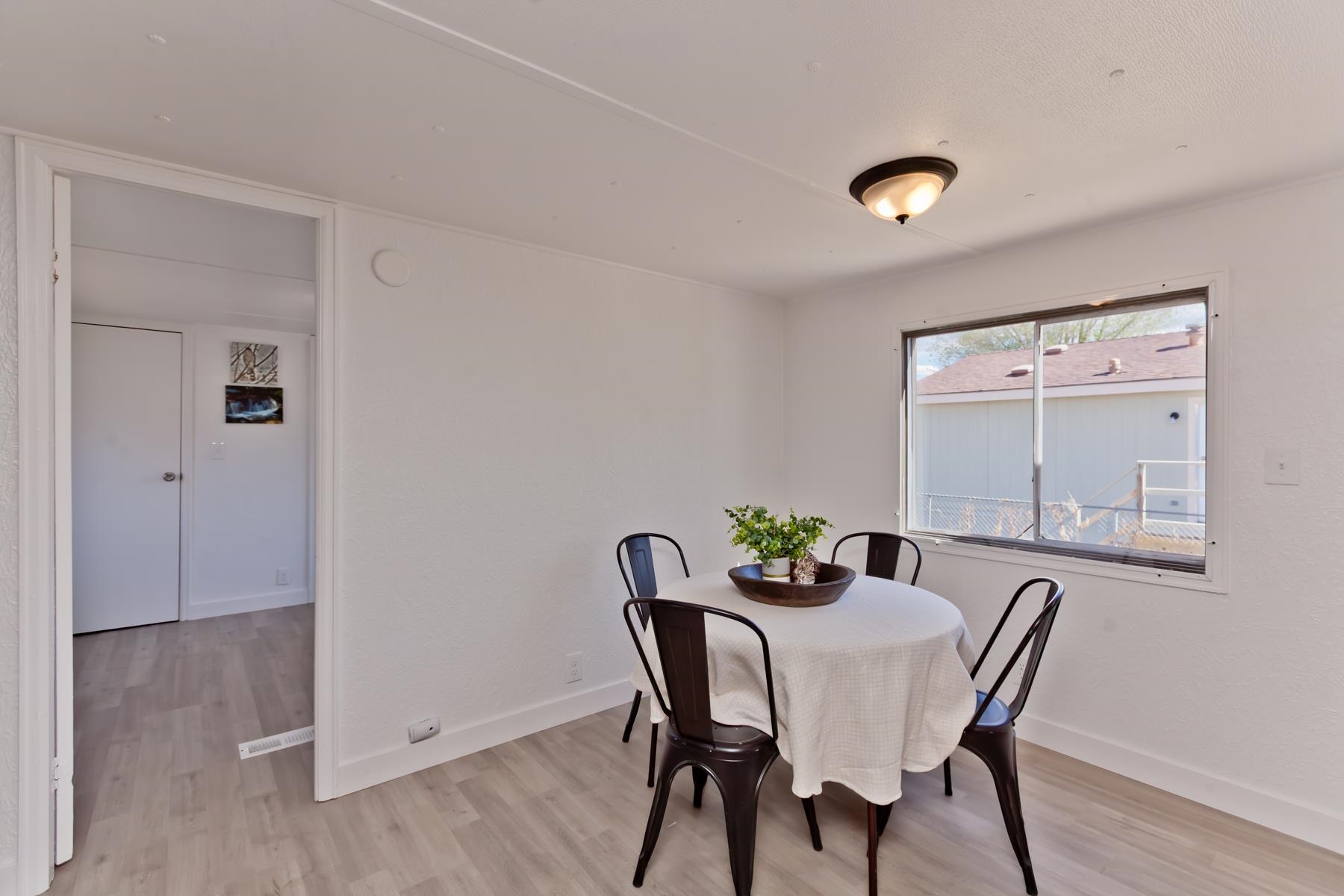 432 Pisces Circle Fruita, CO 81521 - Photo 14 of 40 a view of a dining room with furniture and wooden floor