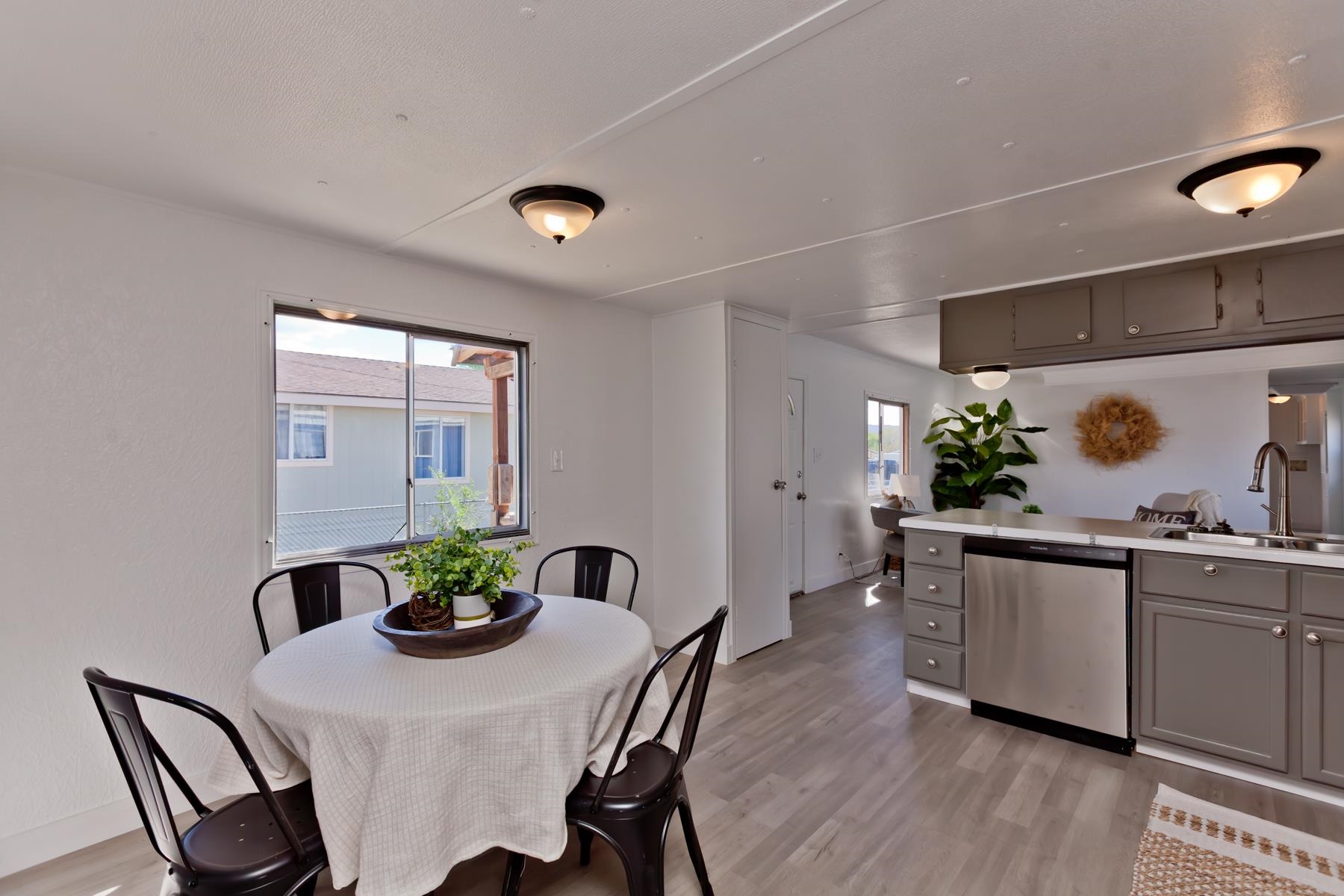 432 Pisces Circle Fruita, CO 81521 - Photo 15 of 40 a dining room with furniture potted plants and wooden floor