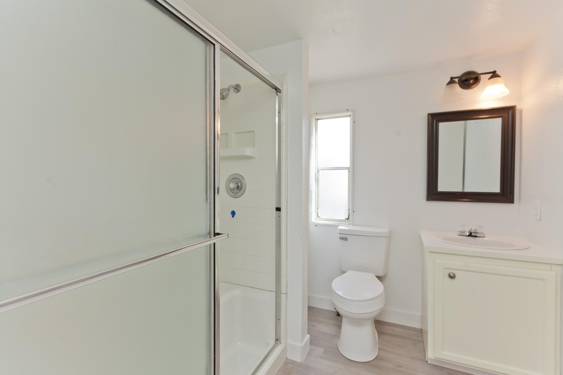 432 Pisces Circle Fruita, CO 81521 - Photo 27 of 40 a bathroom with a toilet a sink and mirror