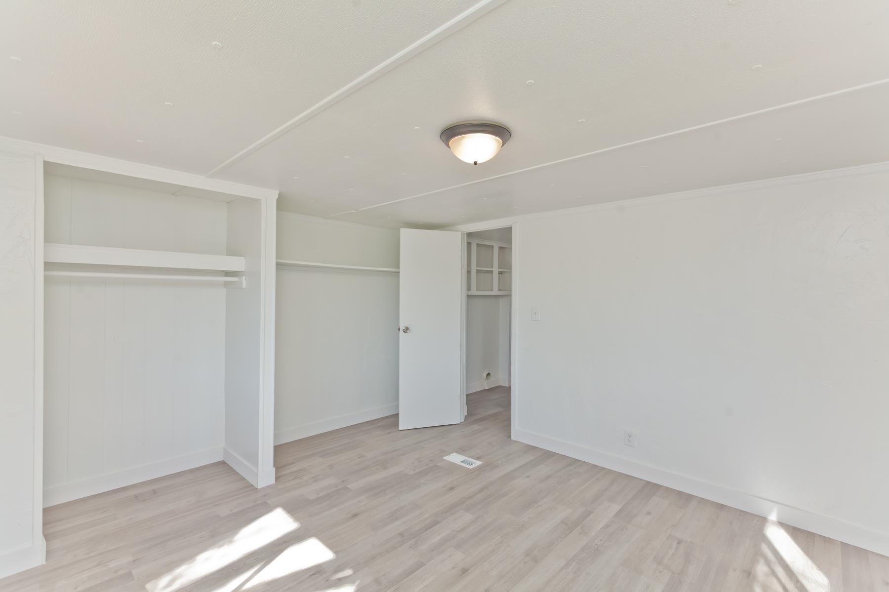 432 Pisces Circle Fruita, CO 81521 - Photo 33 of 40 a view of an empty room with wooden floor
