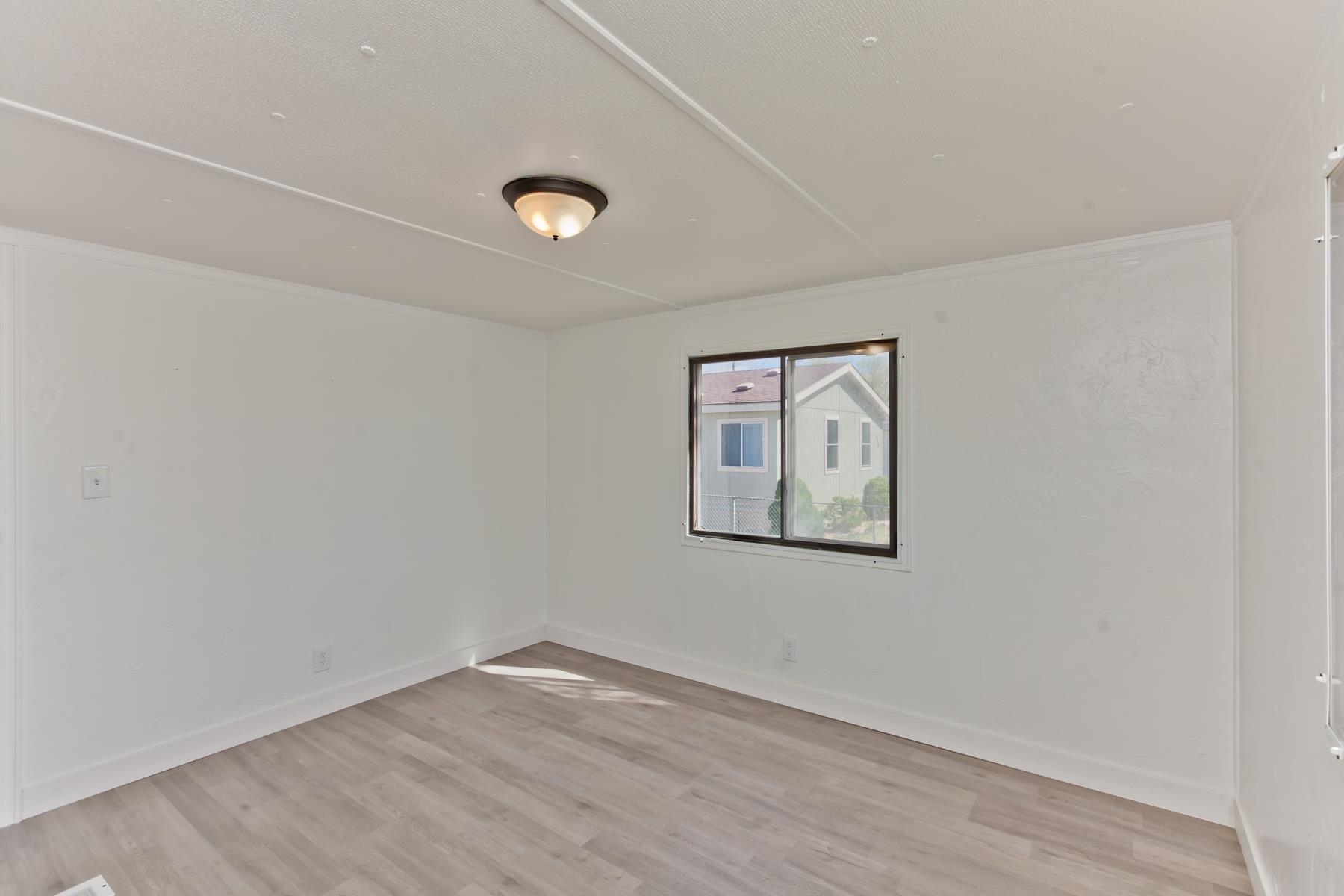 432 Pisces Circle Fruita, CO 81521 - Photo 35 of 40 an empty room with a painting on the wall